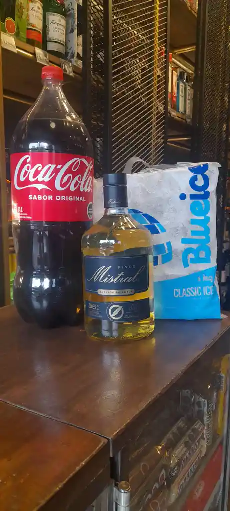 Promo Pisco Mistral 1 Lt. + Coca Cola Normal 3 Lt. + Hielo 1 Kg