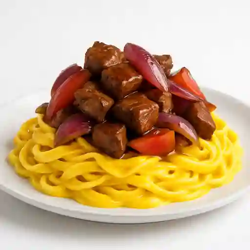 Fettuccini a la Huancaina con Lomo Salteado