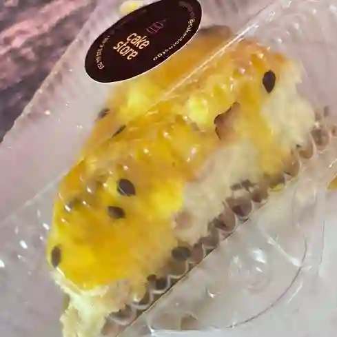 Porción Cheesecake Ny Maracuyá