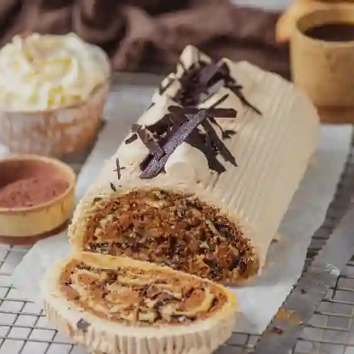 Brazo manjar ramas de chocolate porción