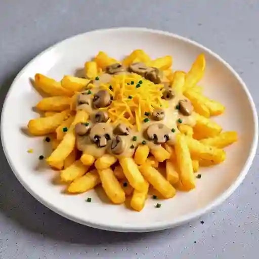 Papas Fritas + Queso Cheddar + Ciboulette + Salsa Champinon