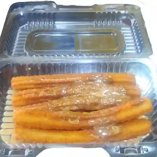 20 Churros calientitos con azúcar/manjar