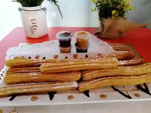 20 Und de Churros con Salsa de Manjar O Chocolate