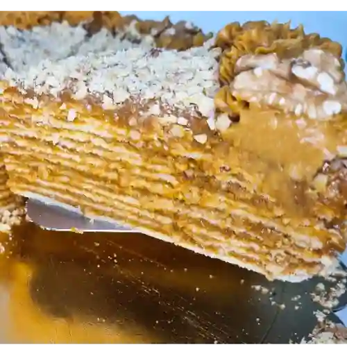 Porción Torta Panqueque Manjar Nuez