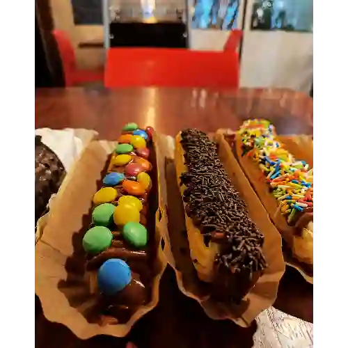 1 Churro Xl Relleno y Bañado + Topping