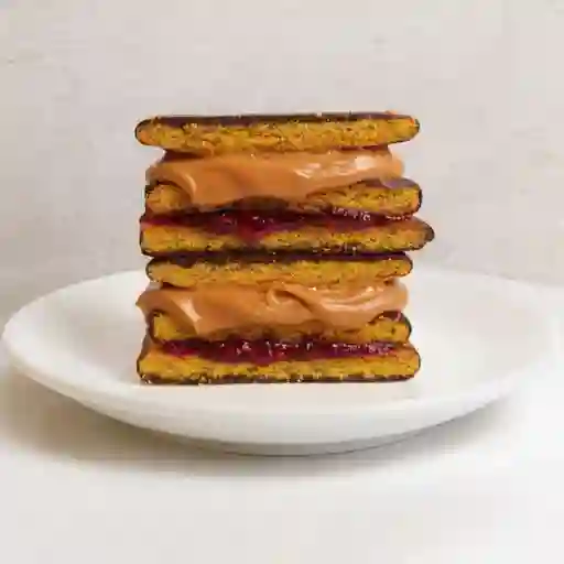 Alfajor frambuesa/manjar choco negro